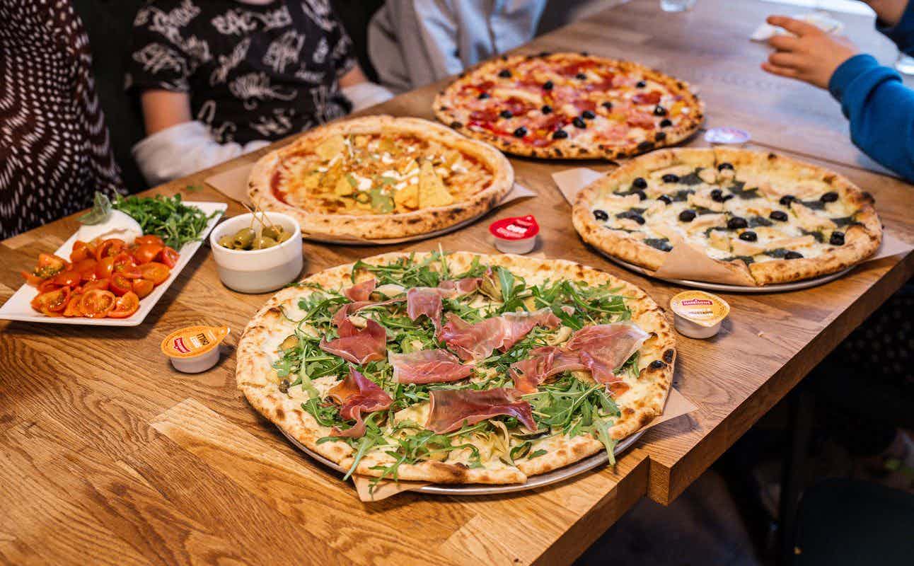 Enjoy Pizza, Italian, Vegan, Gluten Free Options, Vegan Options, Vegetarian options, Restaurant, Indoor & Outdoor Seating, Highchairs available, Wheelchair accessible, Table service, Dog friendly, $$, Families and Groups cuisine at The Pizza Room Mile End in Mile End, London