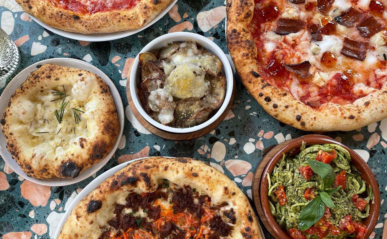Enjoy Pizza, Italian, Vegan Options, Vegetarian options, Gluten Free Options, Restaurant, Highchairs available, Wheelchair accessible, Free Wifi, Dog friendly, $$, Families and Groups cuisine at Purezza Manchester in Northern Quarter, Manchester