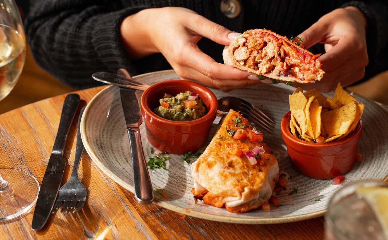 Enjoy Mexican, Latin American, Cuban, Vegetarian options, Vegan Options, Restaurant, Highchairs available, Wheelchair accessible, Free Wifi, $$, Live music, Families and Groups cuisine at Revolucion de Cuba in Deansgate, Manchester
