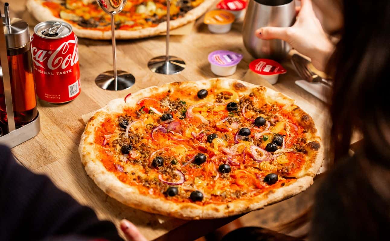 Enjoy Pizza, Italian, Vegan options, Vegetarian options, Gluten Free options, Restaurant, Indoor & outdoor seating, Highchairs available, Wheelchair accessible, Table service, Dog friendly, Non-smoking, $$, Groups and Families cuisine at The Pizza Room Surrey Quays in Surrey Quays, London
