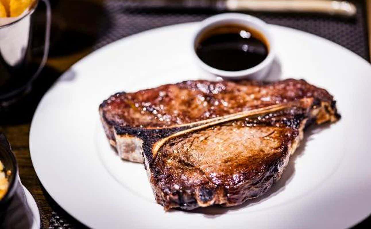 Enjoy Steakhouse cuisine at Manhattan Grill in Canary Wharf, London