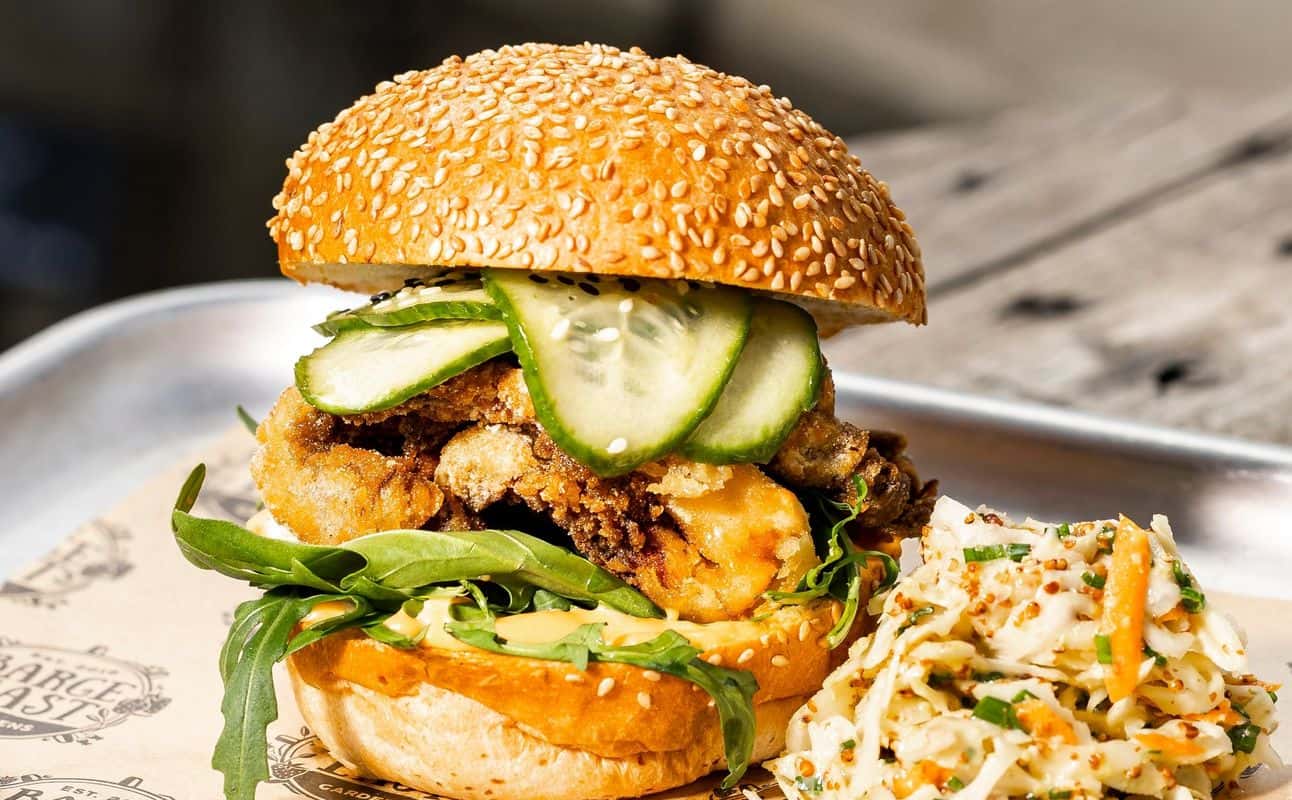 Enjoy Burgers, Vegan options, Gluten Free options, Restaurant, Bars & pubs, Beer garden, Waterfront, Indoor & outdoor seating, Free wifi, Dog friendly, Child friendly, $$, Families, Groups and All patrons under 18 must be accompanied by a parent or legal guardian. cuisine at The Gardens at Barge East in Hackney Wick, London