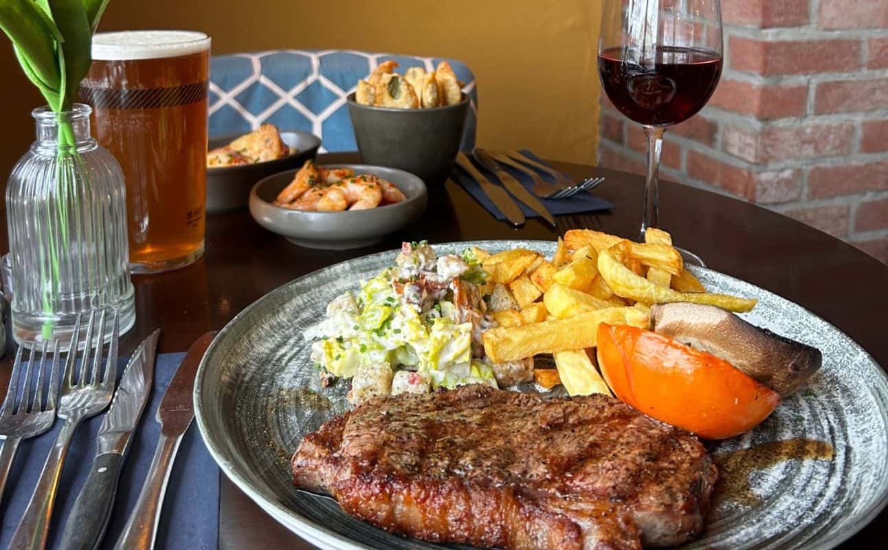 Enjoy Steakhouse, Dairy free options, Gluten Free options, Vegetarian options, Vegan options, Restaurant, Free wifi, Table service, Private dining, Highchairs available, Indoor & outdoor seating, $$$, Families, Groups, Special occasion and Date night cuisine at Kings Head - Acle Steak House in Acle, Norwich