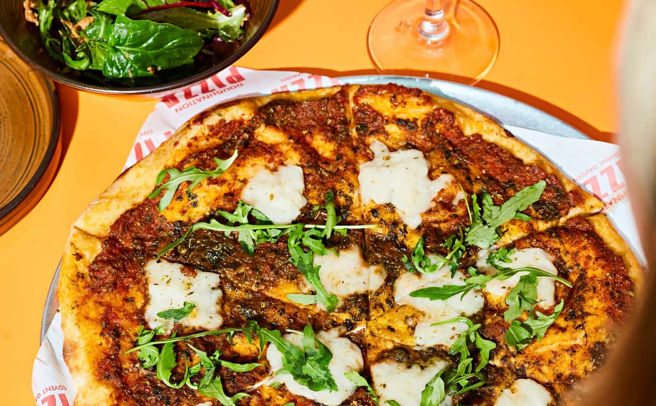 Enjoy Pizza, Gluten Free options, Vegan options, Restaurant, Dog friendly, Child friendly, Table service, Free wifi, Beer garden, $$, Families, Views, Kids and Date night cuisine at Doughnation Pizza in Covent Garden, London