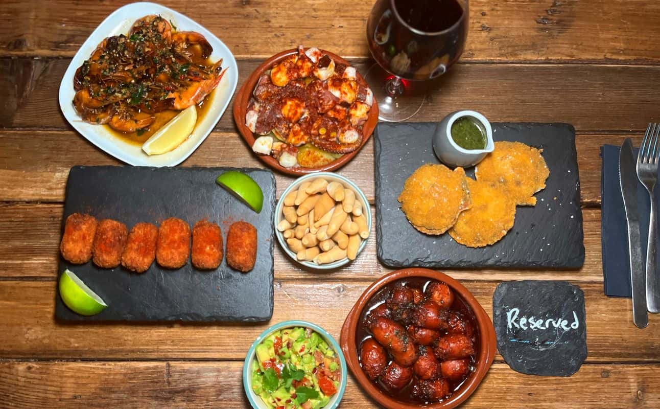 Enjoy Small plates, Spanish, Vegetarian options, Gluten Free options, Vegan options, Restaurant, Bars & pubs, Cocktail bar, Wine bar, Indoor & outdoor seating, $$, Groups, Live music, Bar scene, Date night, Wine bar, Hidden gems and All patrons under 18 must be accompanied by a parent or legal guardian. cuisine at La Bodega de Battersea Spanish in Battersea, London