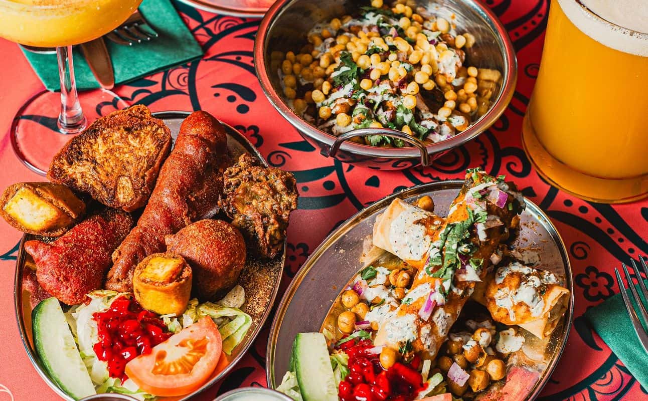 Enjoy Indian, Street food, Vegetarian options, Vegan options, Gluten Free options, Restaurant, Dog friendly, Non-smoking, Table service, Indoor & outdoor seating, Highchairs available, $$, Groups and Families cuisine at The Pakora Bar in Holyrood, Edinburgh